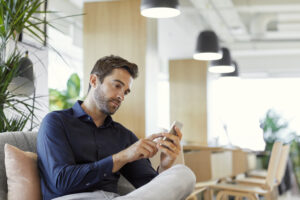 Young man working on his phone 